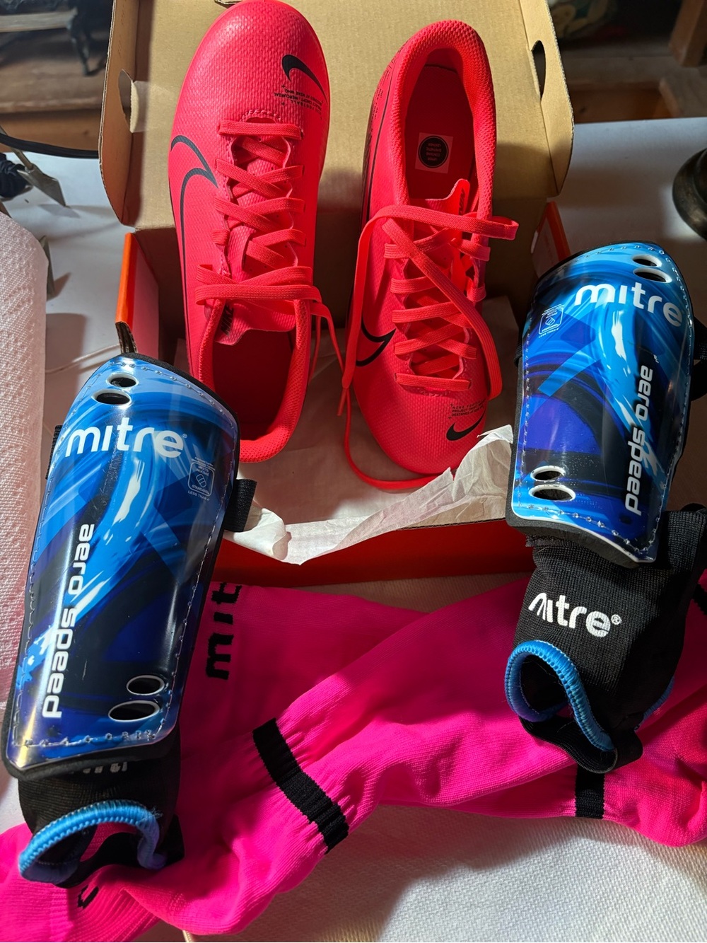 Nike Hot Pink Soccer Cleats with Blue Mitre Shin Guards